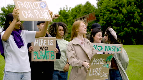 group of  people in a protest with megaphones and placards 1