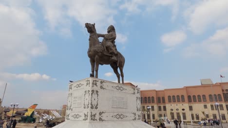 view of equestrian statue in citadel of saladin. cairo, egypt. military aircrafts and rockets at background. hand held.