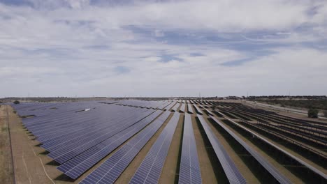 circling aerial view of solar panel farm in ourique, portugal