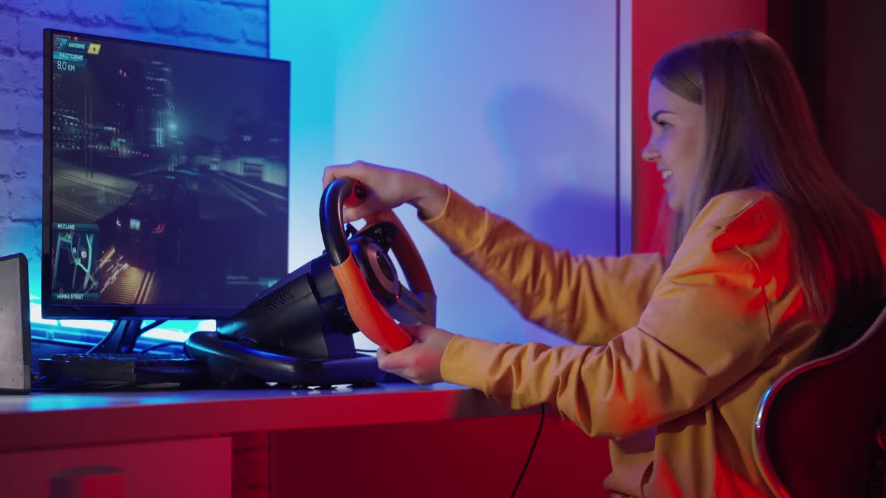 Gamer plays video game. Girl with joystick playing racing game in room at night