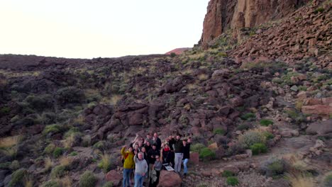 drone flight to a large family visiting a rocky desert national park