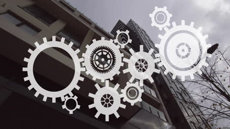 rotating gears animation overlay on modern building exterior