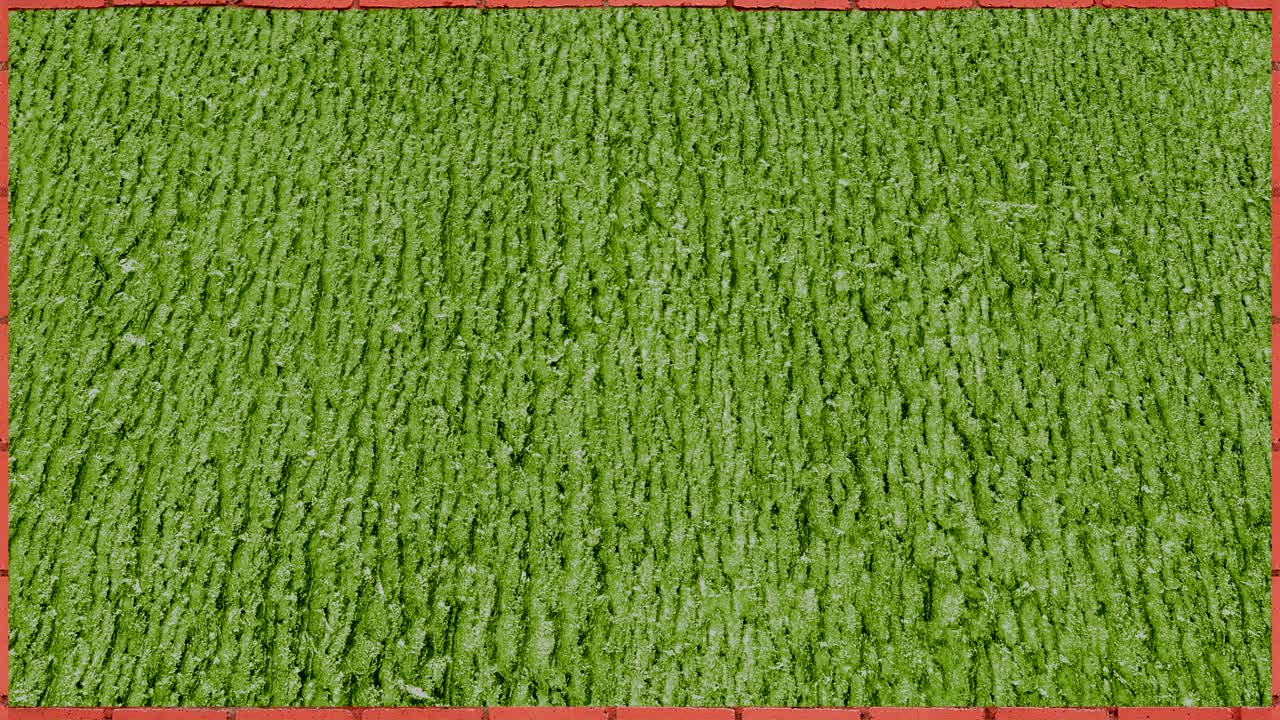 벽돌 프레임에 뛰어다니는 축구공의 애니메이션입니다.