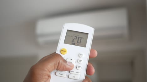 adjusting air conditioner temperature