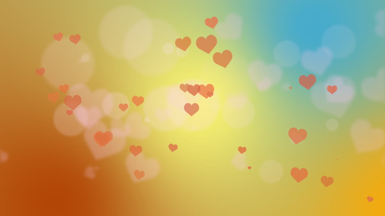 Soft blurred yellow background with bokeh and heart shapes. Wedding romantic abstract background.