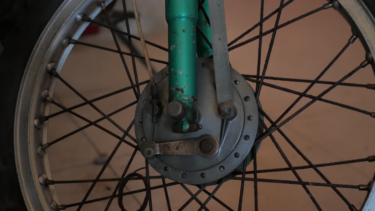 Close shot of a drum brake. It belongs to an old motorcycle
