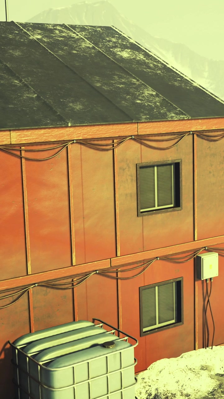 Building with orange exterior and snow on roof in winter weather