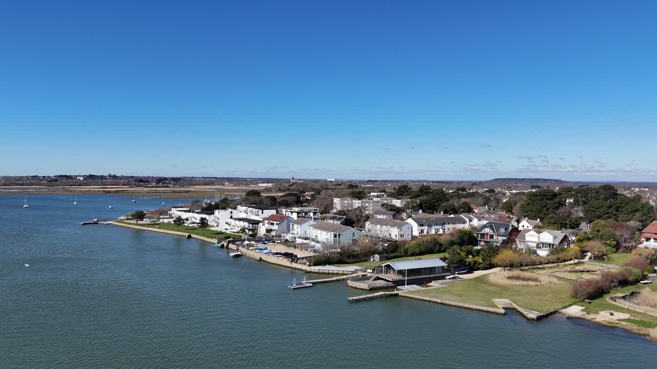 Large Waterfront houses Mudeford Christchurch UK clear blue sky background