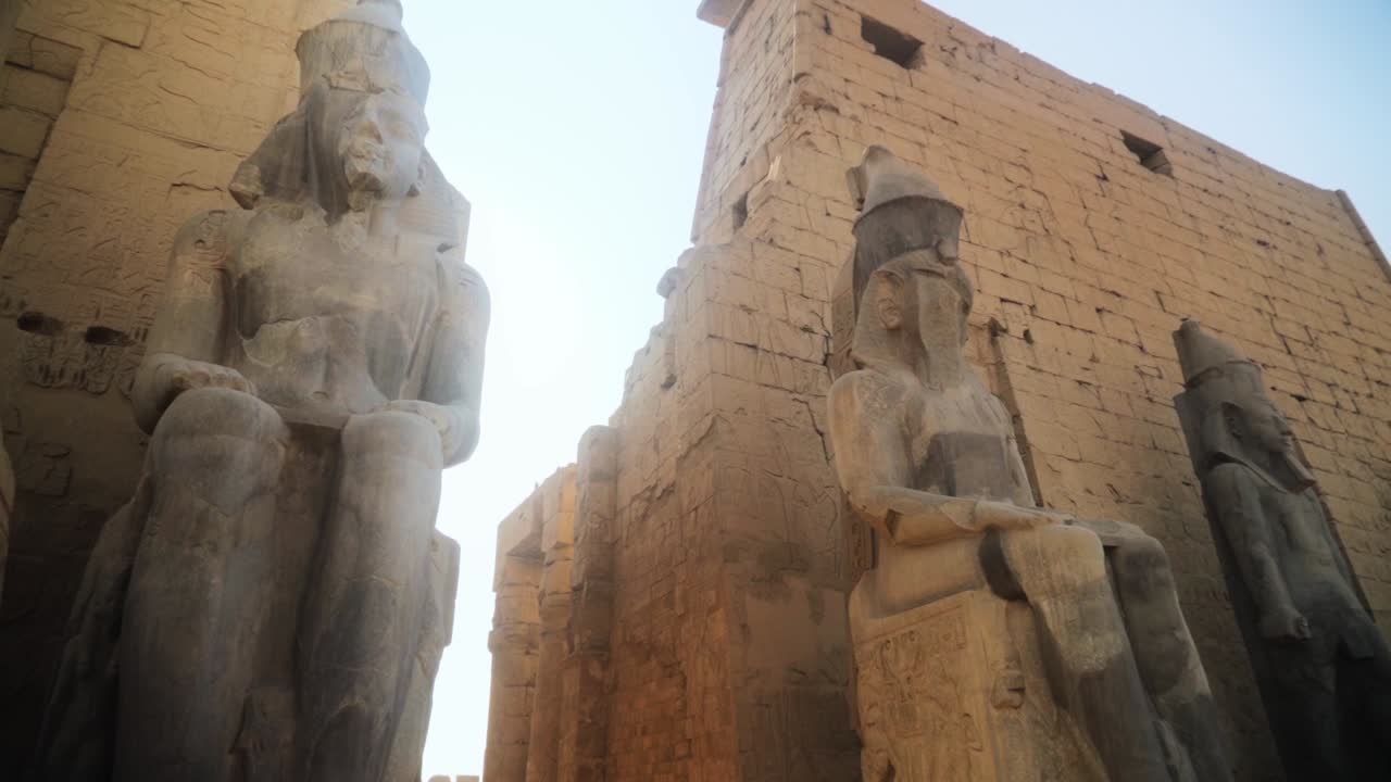 Large statues of Kings in the Karnak Temple of Luxor, Egypt.Slow camera movement from a low angle