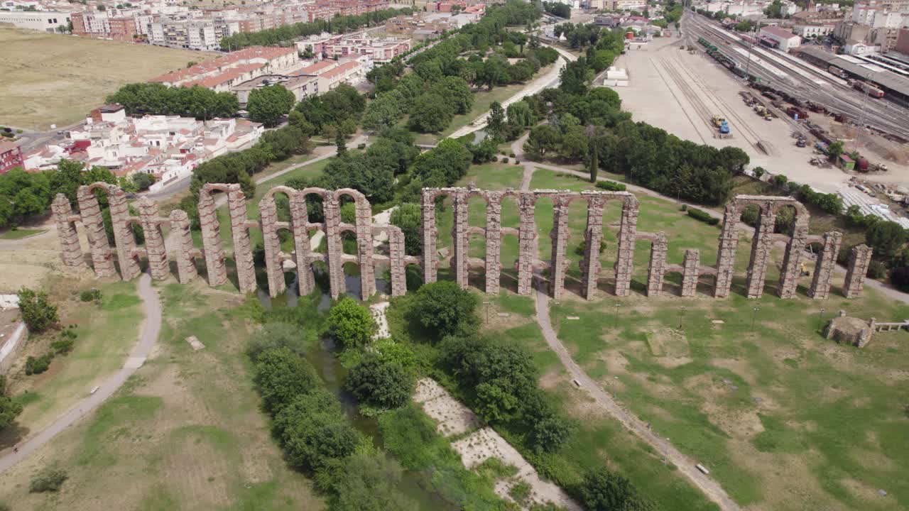 Los Milagros aqueduct or aqueduct of miracles aerial view rising away from ancient ruin brick pillars in M&eacute;rida, Spain