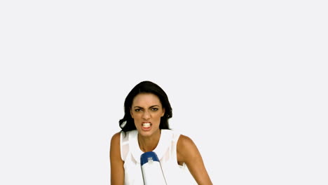 Angry-businesswoman-shouting-on-megaphone-and-jumping-up