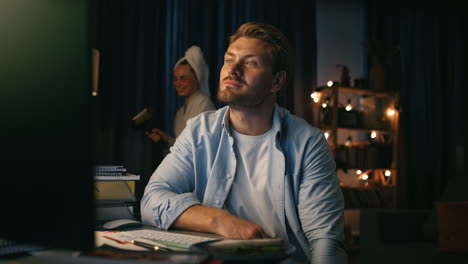 Positive-man-talking-remotely-closeup.-Guy-feeling-distracted-by-woman-home