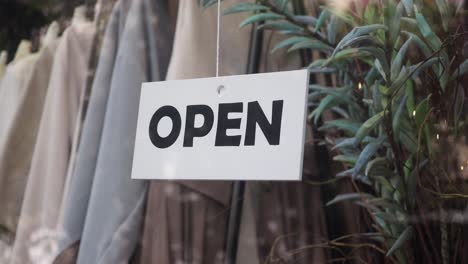 open sign in a shop window