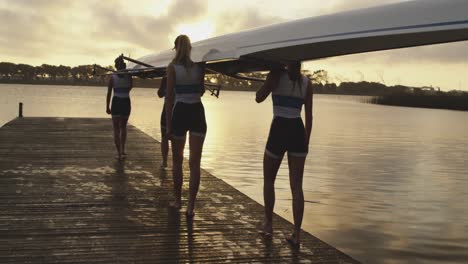 female rowing team training on a river