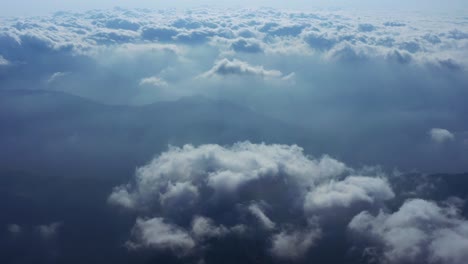 camera is raising above from the thick fog above the beautiful ocean of clouds