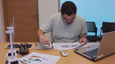 middle eastern professional holding up a blank sheet for copyspace