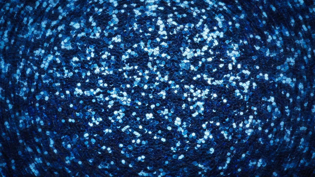 Abstract background of glowing blue glitter