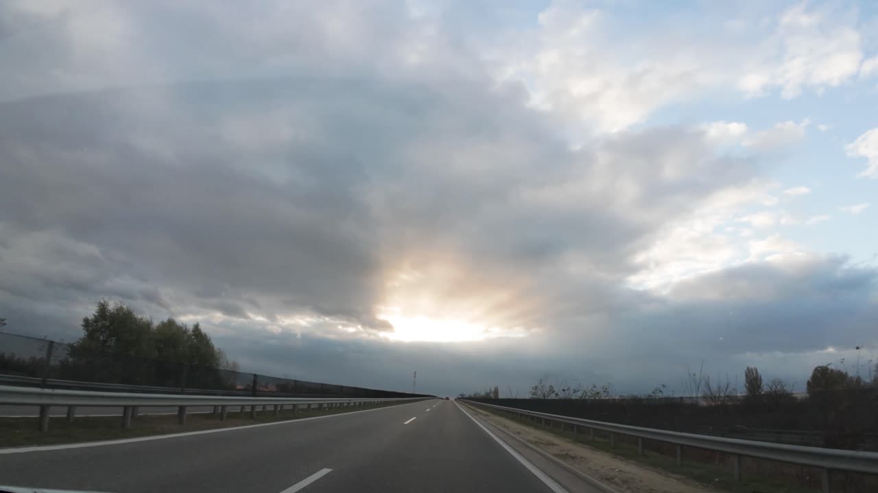 Onboard dash footage of Austiran highway infrastructure during late autumn, cloudy sunset, timelapse