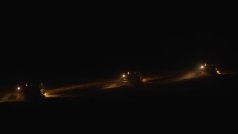 massive rice field mechanized harvesting at night