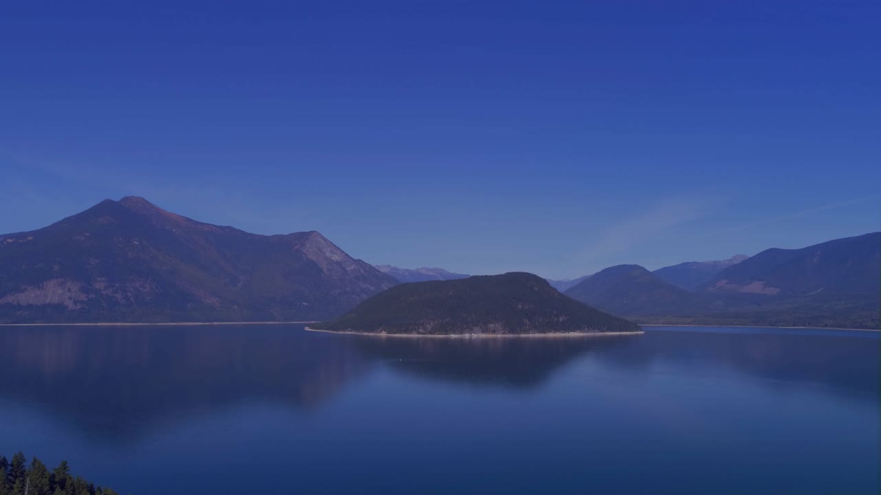 On sensor pulse HUD overlay animating over mountain lake, charts rising to show live trends