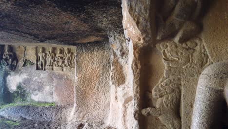 buddha sculpture on wall at pandav leni caves in nashik, india - panning