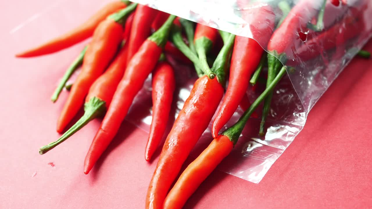 Dried peppers in a plastic bag on floor