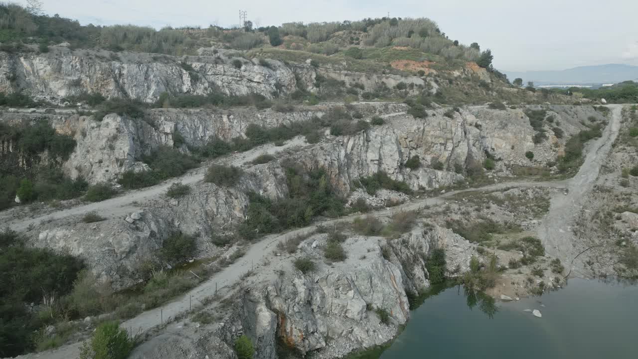 Wide view of can rovira quarry in sant fost de campsentelles, near barcelona, showing the industrial impact on the landscape and environment