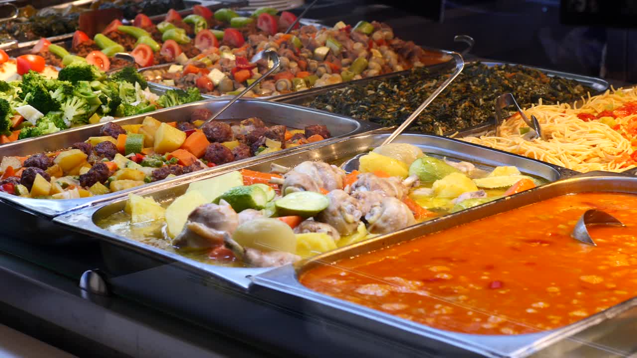 Variety of hot dishes on a buffet line