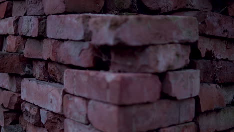 heap of old ruin bricks laid outdoor for construction