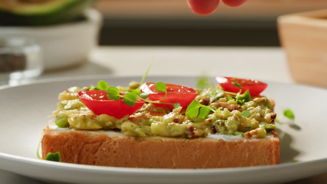 Delicious Avocado Toast with Microgreens and Cherry Tomatoes