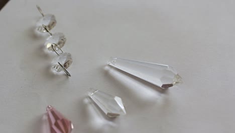 balls of glass crystal refracting light in a white background - close up