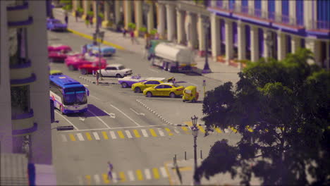 colourful stop motion, miniature world of vintage cars stopped at traffic lights in the city at rush hour