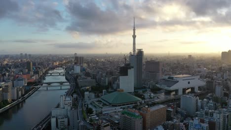 aerial of the tokyo skytree is seen at sunset nestled in the skyline of tokyo japan