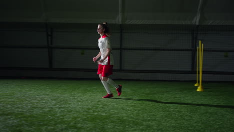 woman soccer player training indoors