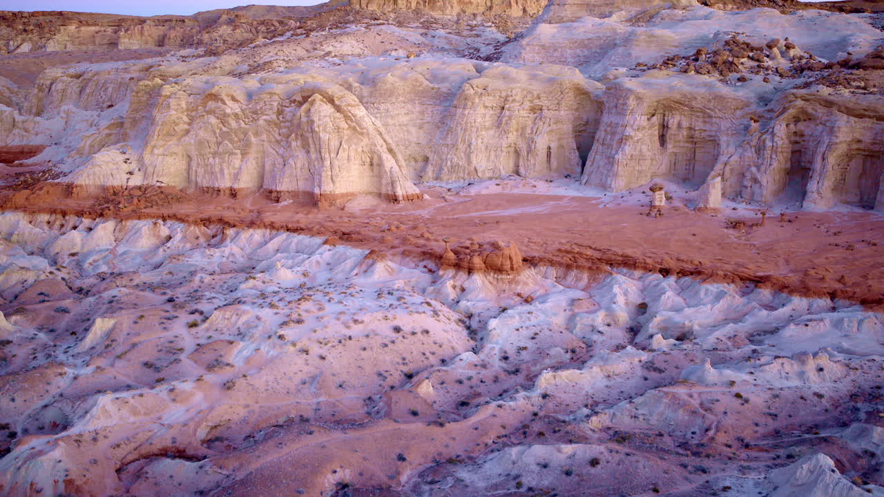 From the sky, the desert becomes a canvas—brushed with color and carved into surreal shapes.