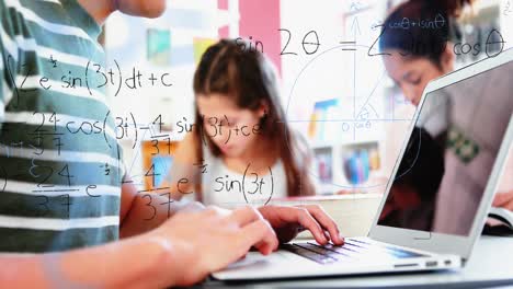 mathematical equations floating against boy using laptop at school