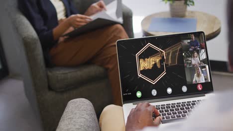 African-american-businessman-using-laptop-for-video-call-with-diverse-business-colleagues