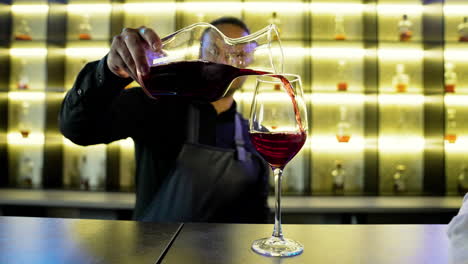 bartender pouring wine