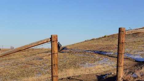 Mountain-bikers-riding-in-a-rural-trail