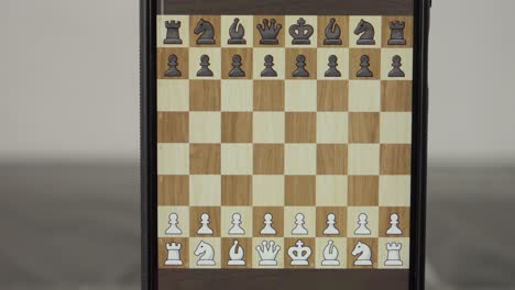 game interface on smartphone screen displays the chessboard and pieces