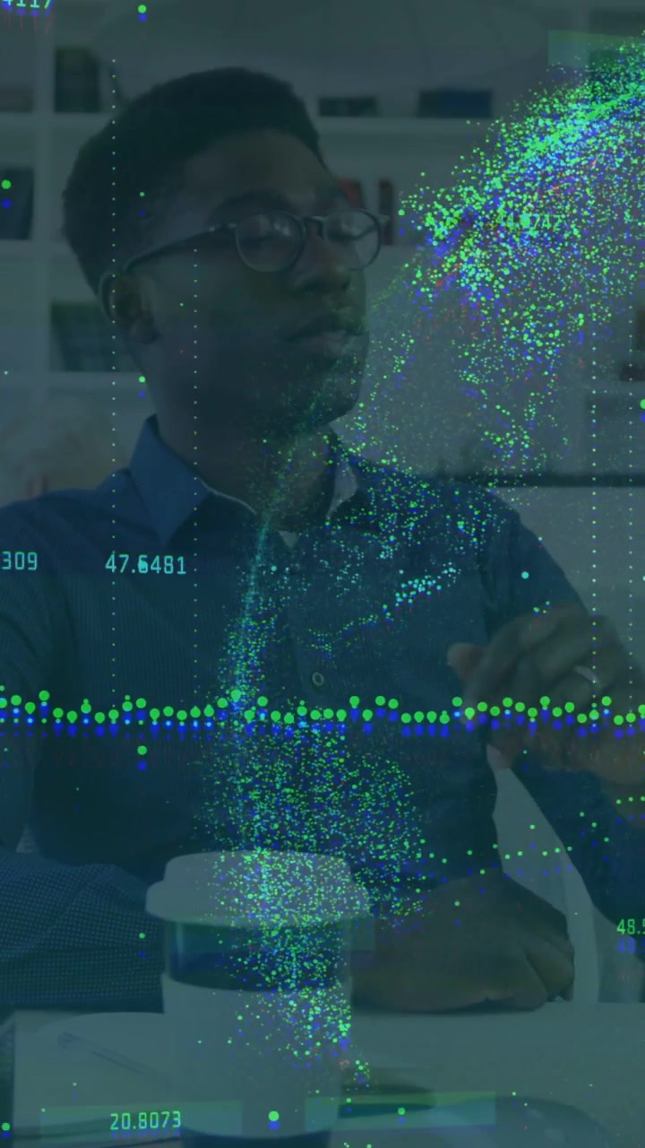 Vertical video: Man following data visuals coming from right, points sweeping near cup to show data