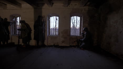 wwii soldiers in an abandoned building