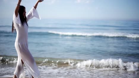 woman on beach dancing 33