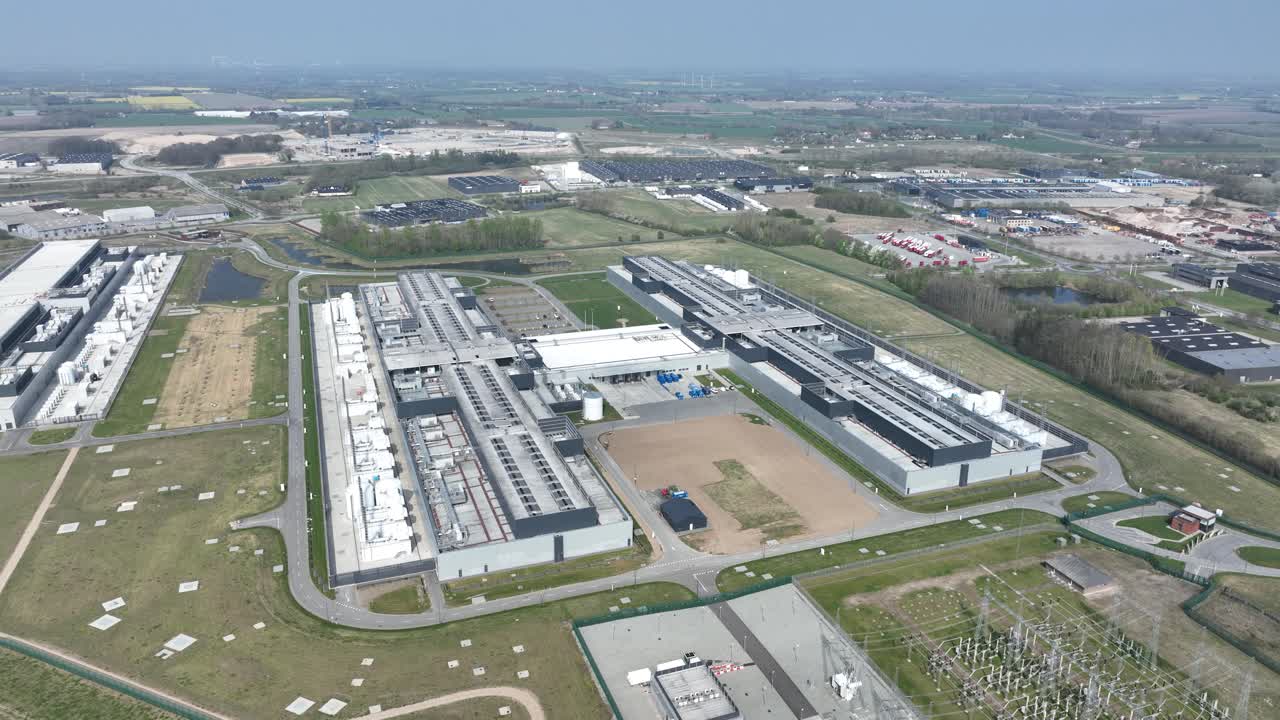 data center, computing center in Odense, Denmark, big tech, IT, Ai, infrastructure, Aerial drone video of the complex.