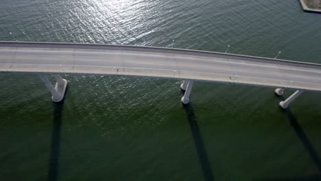 birds eye view ultra wide looking down at car traffic crossing bridge over chesapeake bay-severn river in annapolis