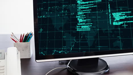 procesamiento de datos a través de la red de cuadrícula y el mapa del mundo en la pantalla de la computadora en una mesa de madera