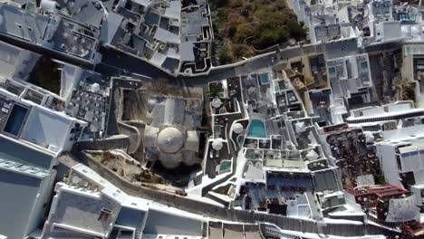 top view over touristic fira traditional settlement houses, santorini, greece