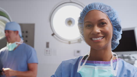 portrait of female surgeon wearing scrubs in hospital operating theater