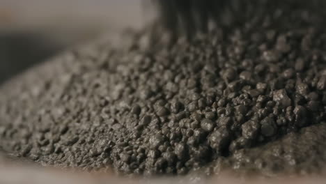 close-up of wet concrete mixture with aggregates