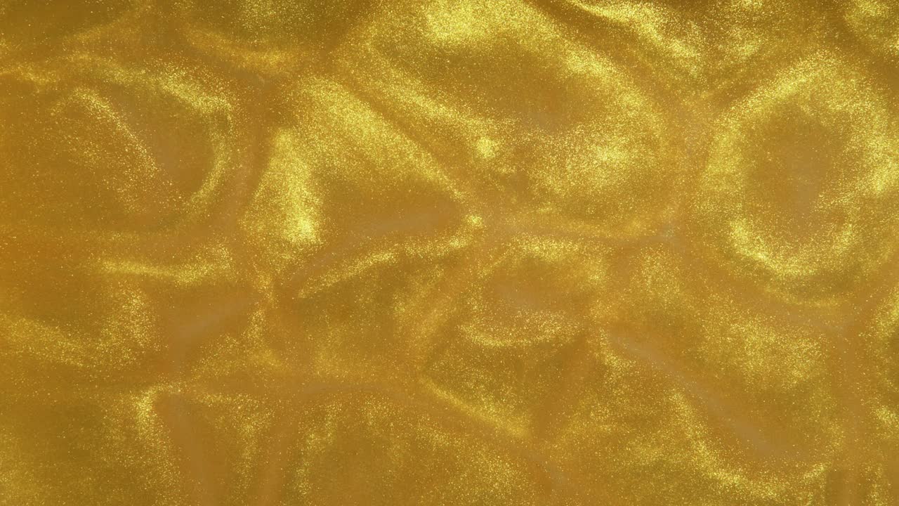 Metallic Gold particles forming cells and flowing based on Bernard Cell principle. Fluid Dynamics. Looping Loopable. RED Camera.